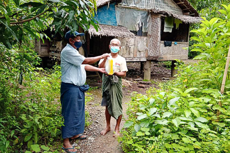 Facemasks and hand sanitizer produced by women supported by Precious Lady are distributed free to households in Rakhine State, Myanmar, during the COVID-19 pandemic. 
