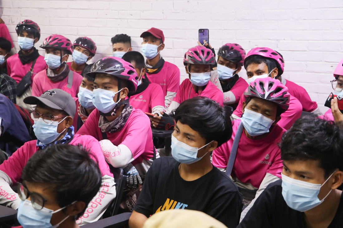 Foodpanda riders attend a TB awareness session in Yangon, Myanmar, in March 2023.
