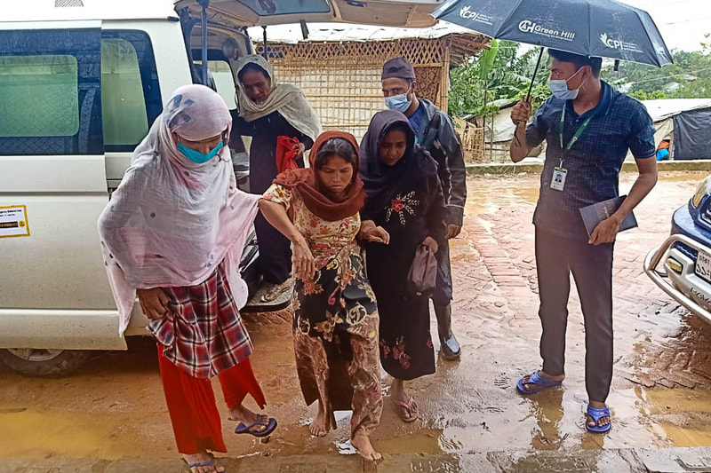Rohingya volunteers provide emergency assistance to fellow refugees during flooding in Kutupalong Refugee Camp, Bangladesh.