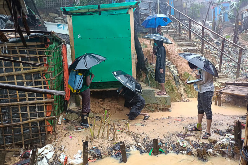 Rohingya volunteers survey WASH facilities for repair in Kutupalong Refugee Camp, Bangladesh.