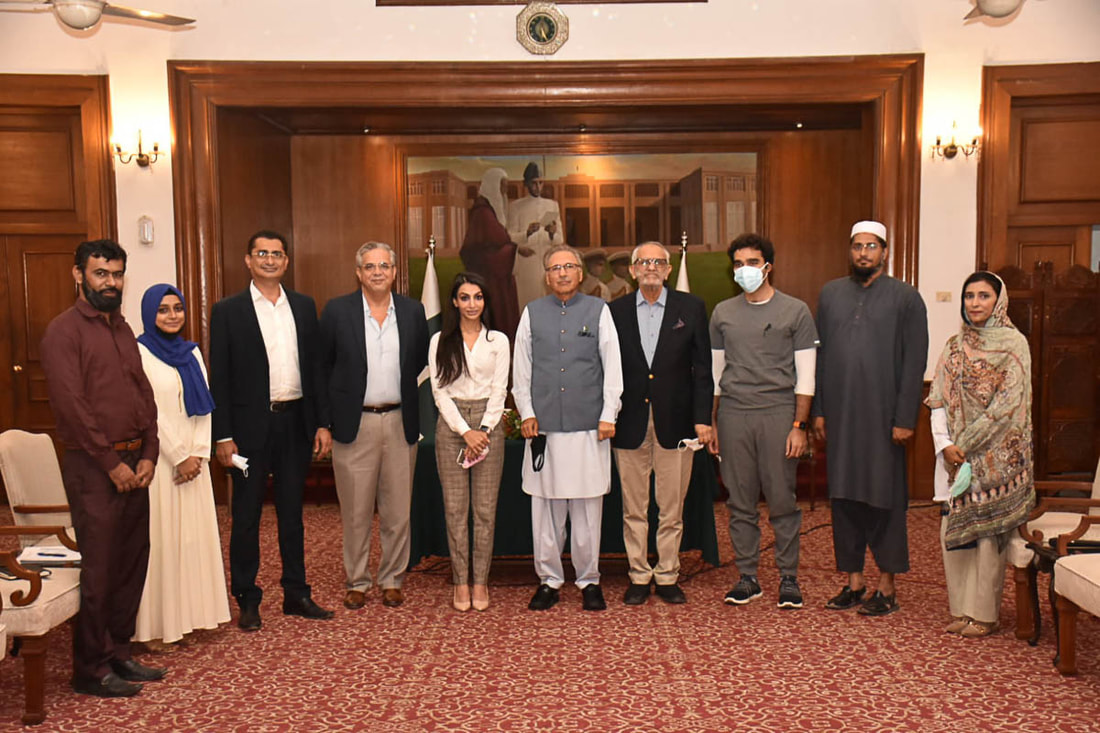 President Dr. Arif Alvi (center) meets with representatives of Community Partners International, SHINE Humanity and the Patients' Aid Foundation in Karachi, Pakistan, on August 30, 2021.