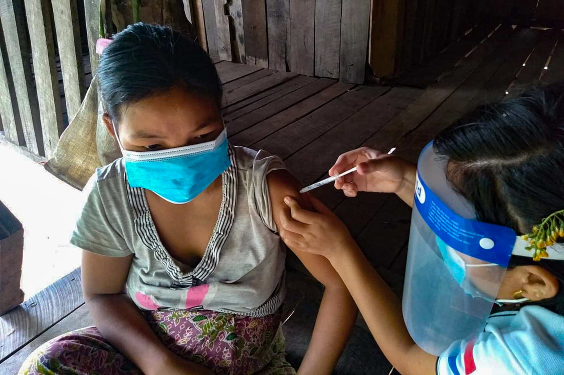 An ethnic health organization health worker vaccinates a pregnant woman in southeast Myanmar. (CPI)