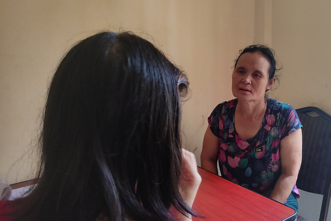 A TWG case manager (right) counsels a survivor of gender-based violence in southeast Myanmar. 