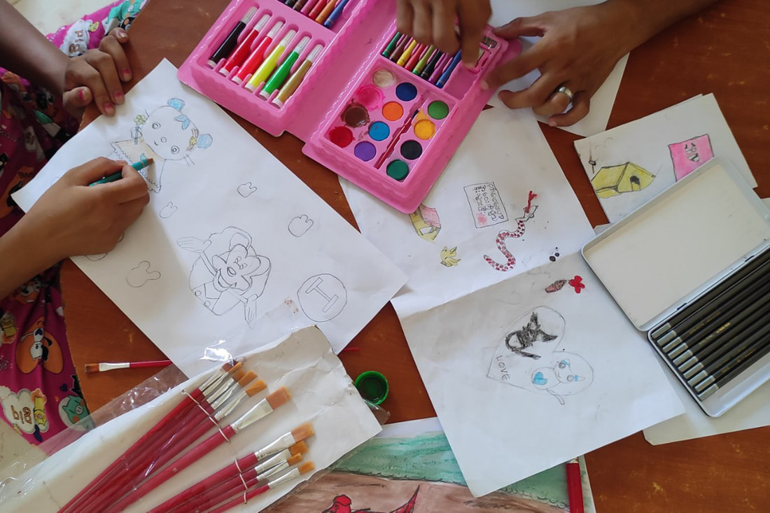 Women at a TWG safe house in southeast Myanmar participate in art activities as part of occupational therapy. 