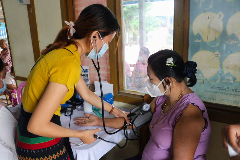 A health worker checks a patient's blood pressure at the YMCA's Yay Sin clinic in Nay Pyi Taw, Myanmar. 