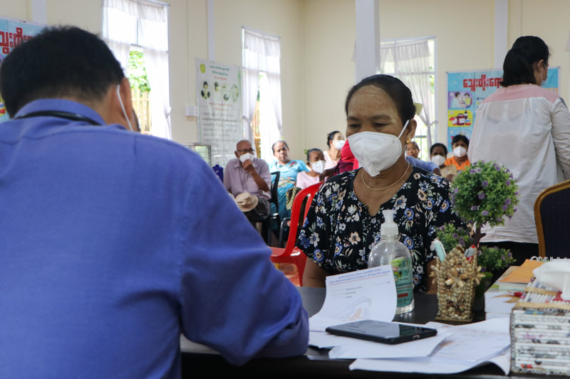 A doctor sees a patient at the YMCA's Pyinmana clinic in Nay Pyi Taw, Myanmar.
