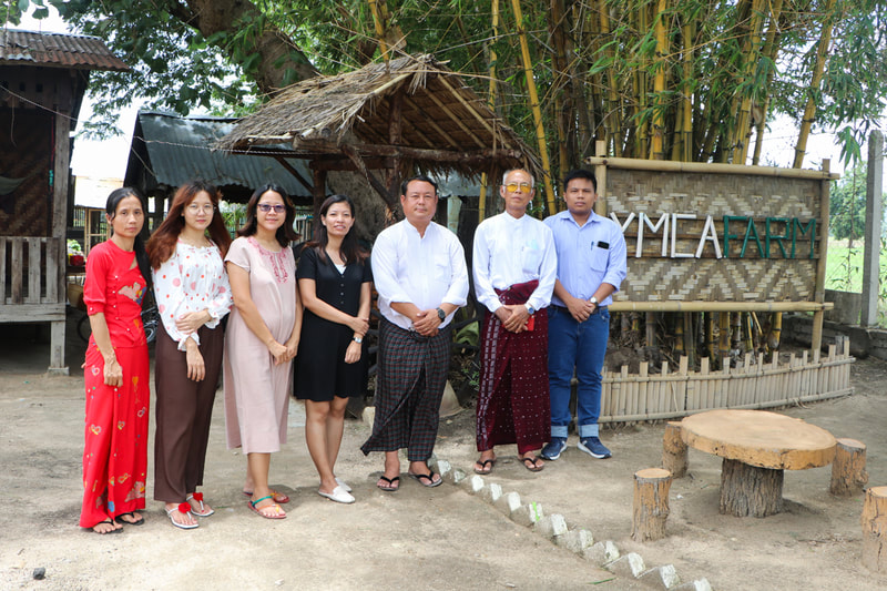 YMCA Nay Pyi Taw Project Manager Saw Jackson (third from right) with YMCA colleagues and partner staff at the YMCA's organic farm in Nay Pyi Taw, Myanmar.