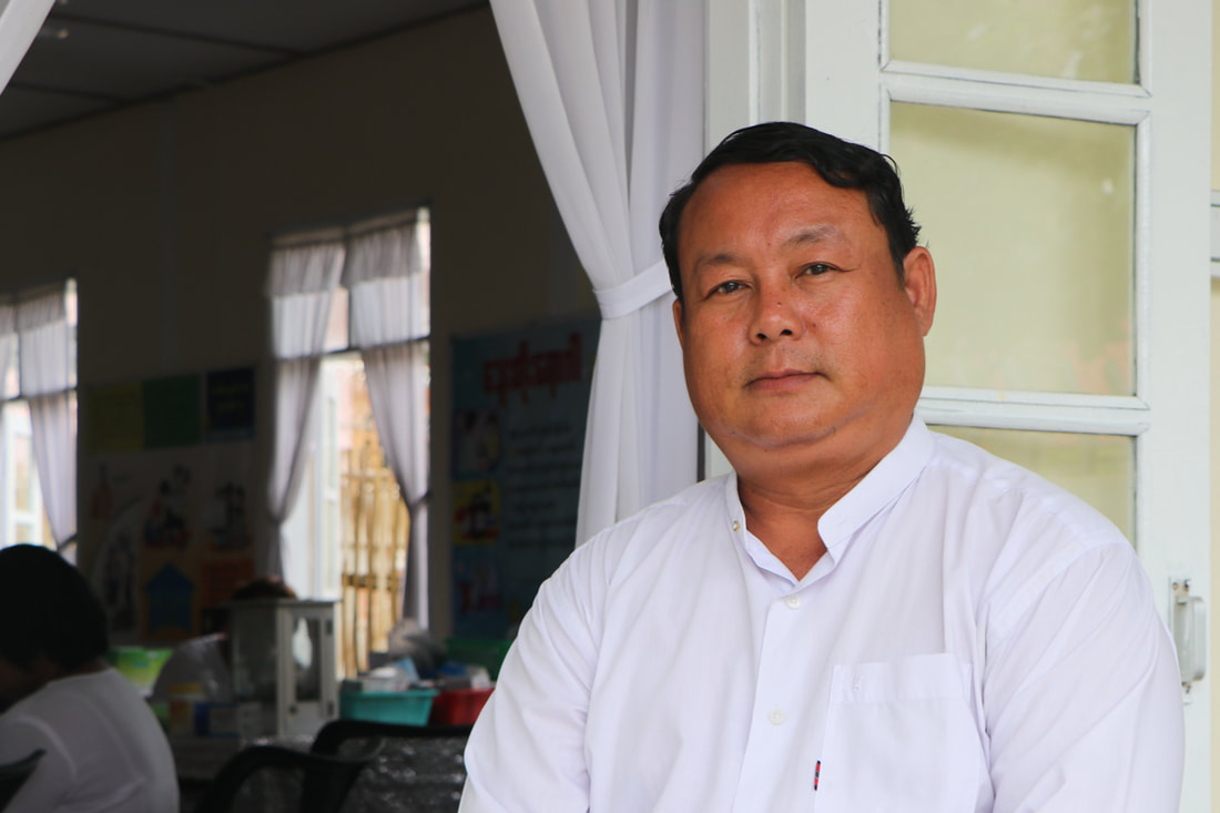 Saw Jackson, YMCA Nay Pyi Taw's Project Manager, outside the organization's clinic in Pyinmana, Myanmar. 
