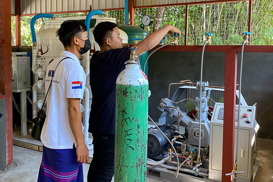 A technician fills a tank with oxygen at the new oxygen plant in Hpa-An, Myanmar.