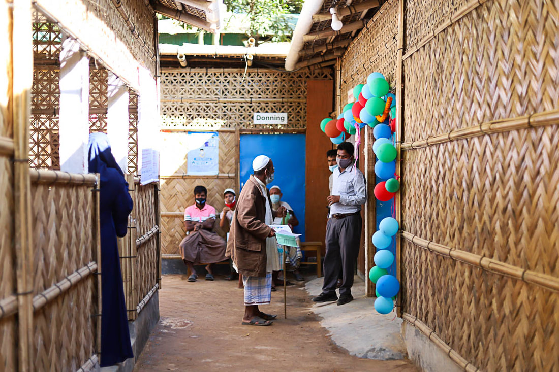 Community members wait to be seen at the new health post supported by CPI in Camp 1W of Kutupalong Refugee Camp, Cox's Bazar, Bangladesh.