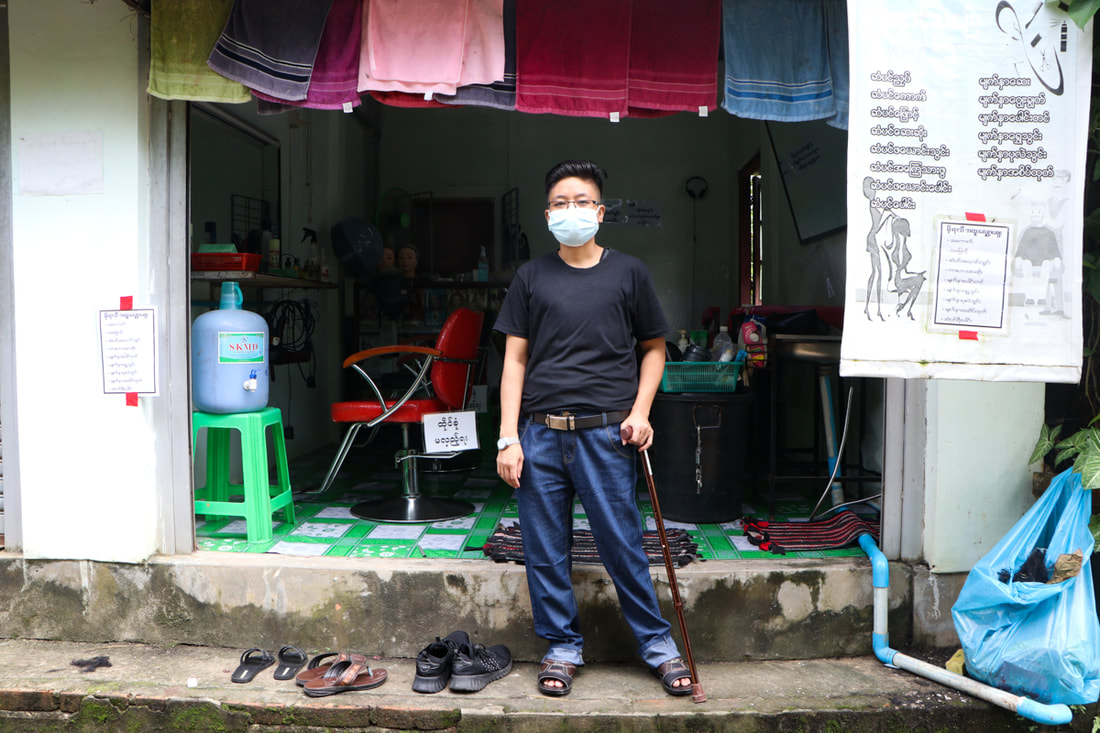 Ko Moe at his hair salon in Insein Township, Yangon, Myanmar.