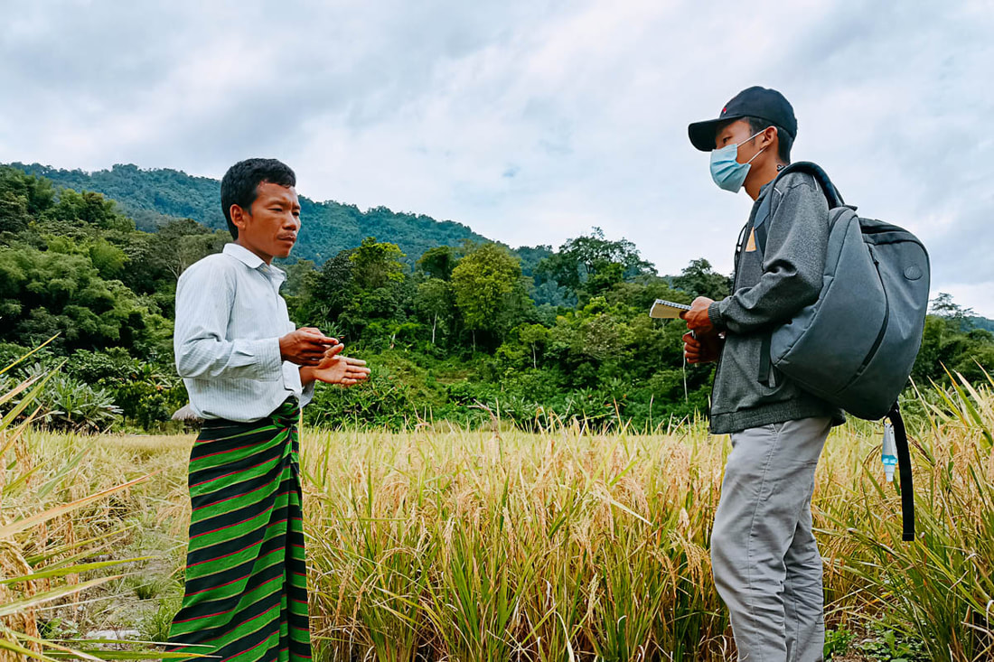 ENDO project manager Vang Sing (right) meets with a farmer from Namlit village in Myanmar's Naga Self-Administered Zone.