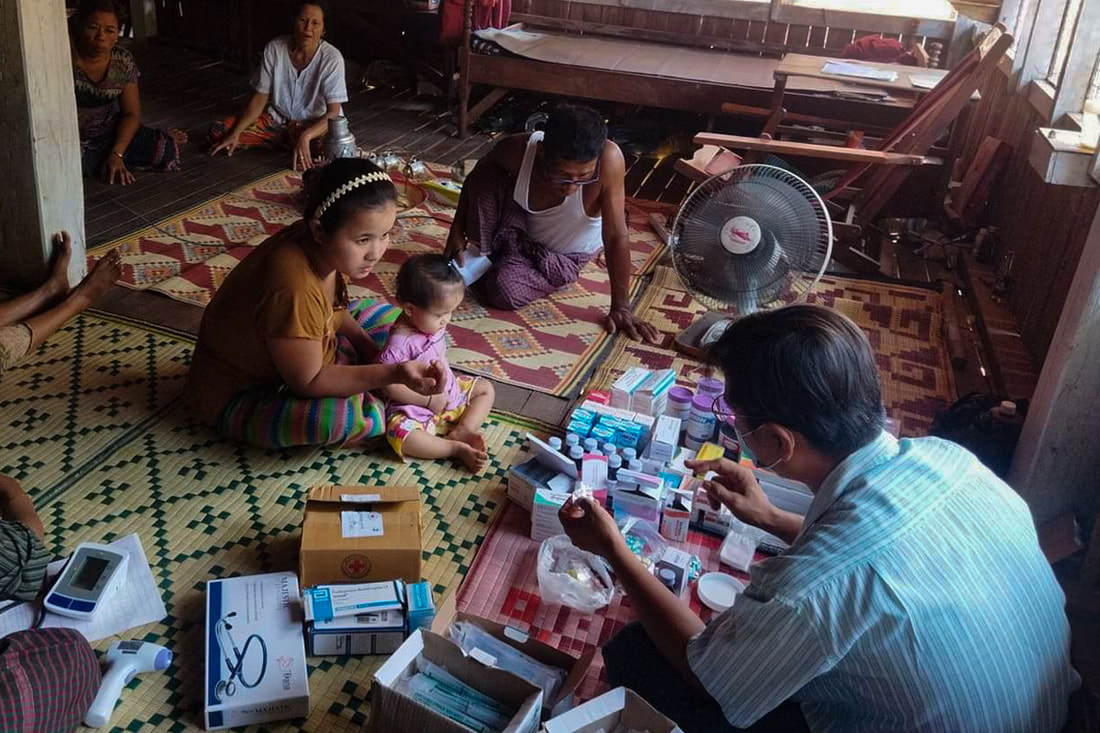 A health worker from the Mon National Health Committee provides health care services to community members in southeast Myanmar. 