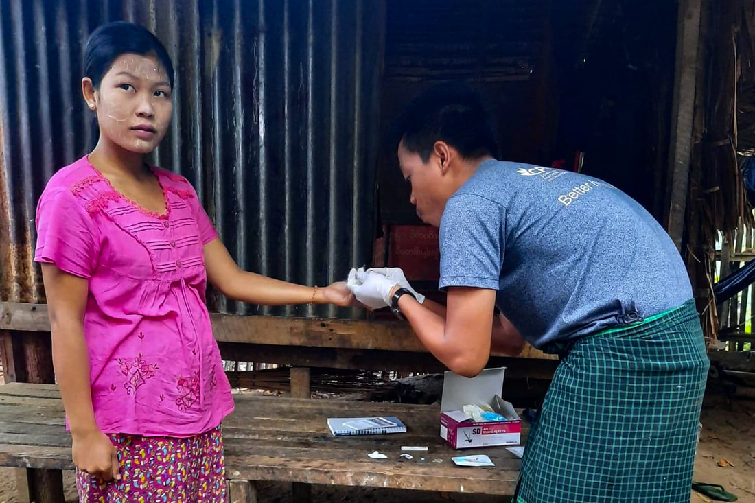 A health worker from the Mon National Health Committee conducts a malaria rapid diagnostic test in southeast Myanmar. 