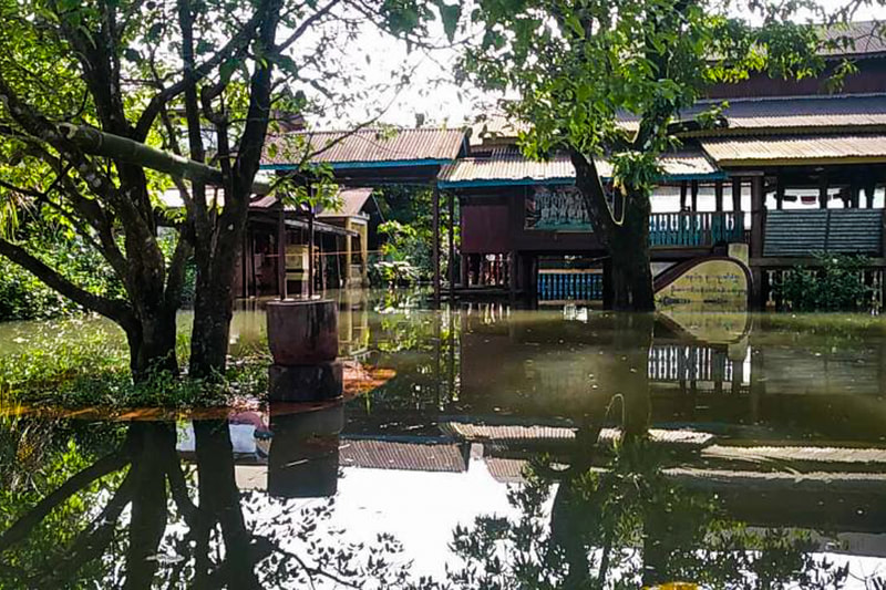 A house surrounded by floodwaters in Karen (Kayin) State, Myanmar. 